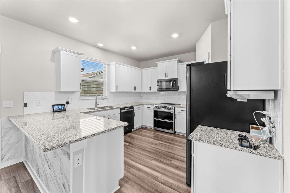 kitchen with granite counter tops and stainless appliances
