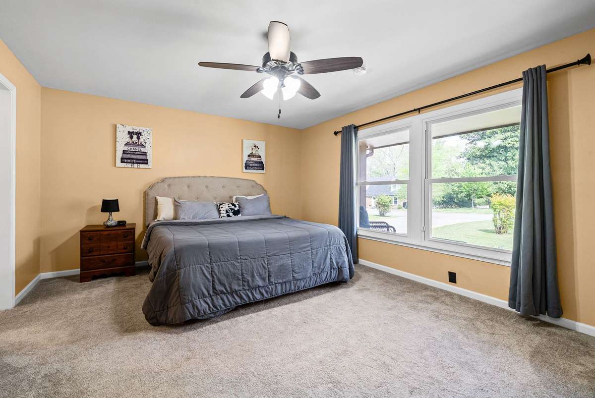 Primary Bedroom Suite on the Main Level with Great Space for a KING Size Bed. Ceiling Fan and Wonderful Natural Light