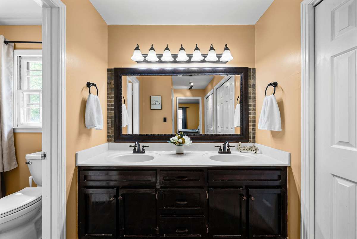 Primary Bathroom Features Double Vanity HUGE Mirror