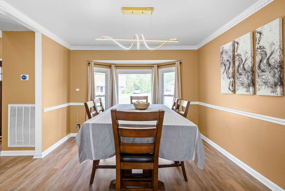 Formal Dining Room with NEW LVP Flooring. Wonderful Natural Light