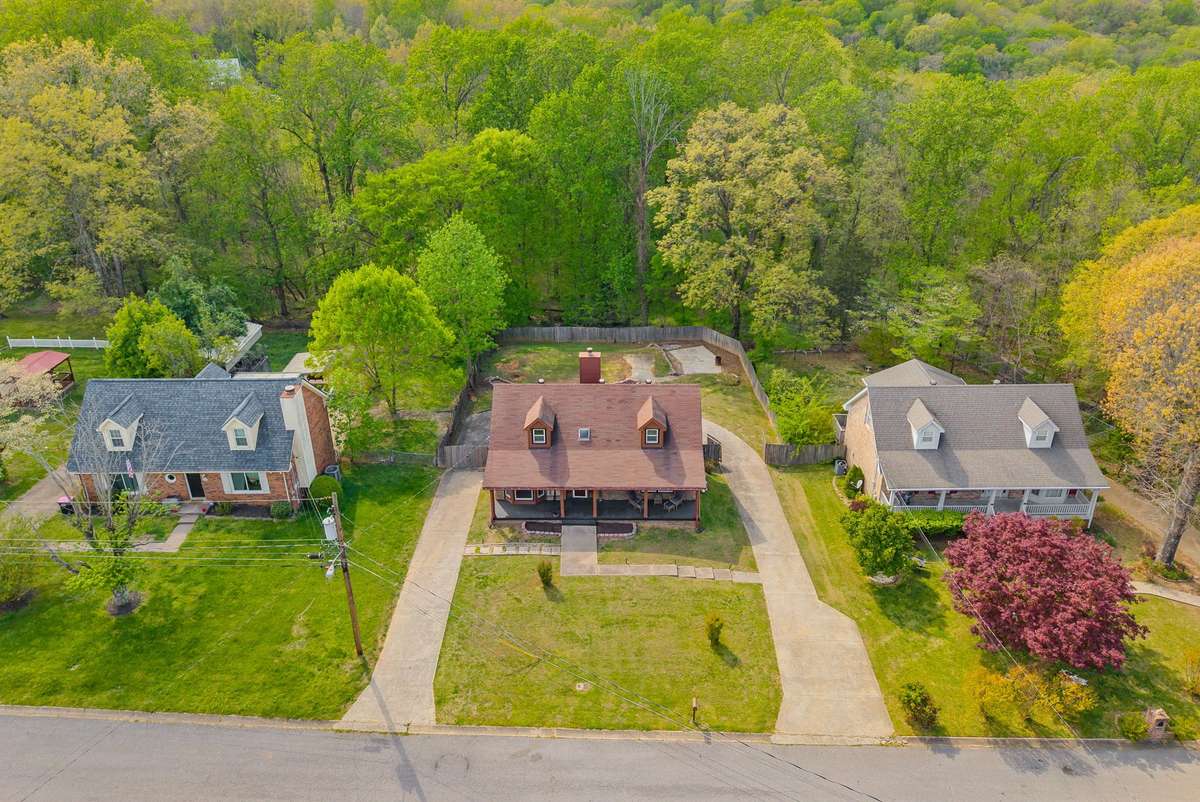 Check out the concrete circle driveway that goes all the way around the home~