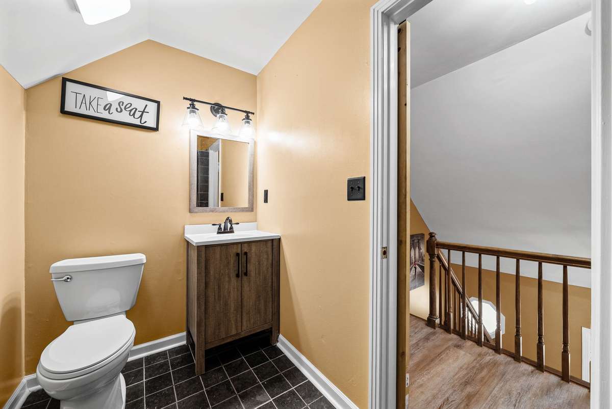 2nd View of the Upstairs Full Bath Featuring a Barn Door. So Cool!
