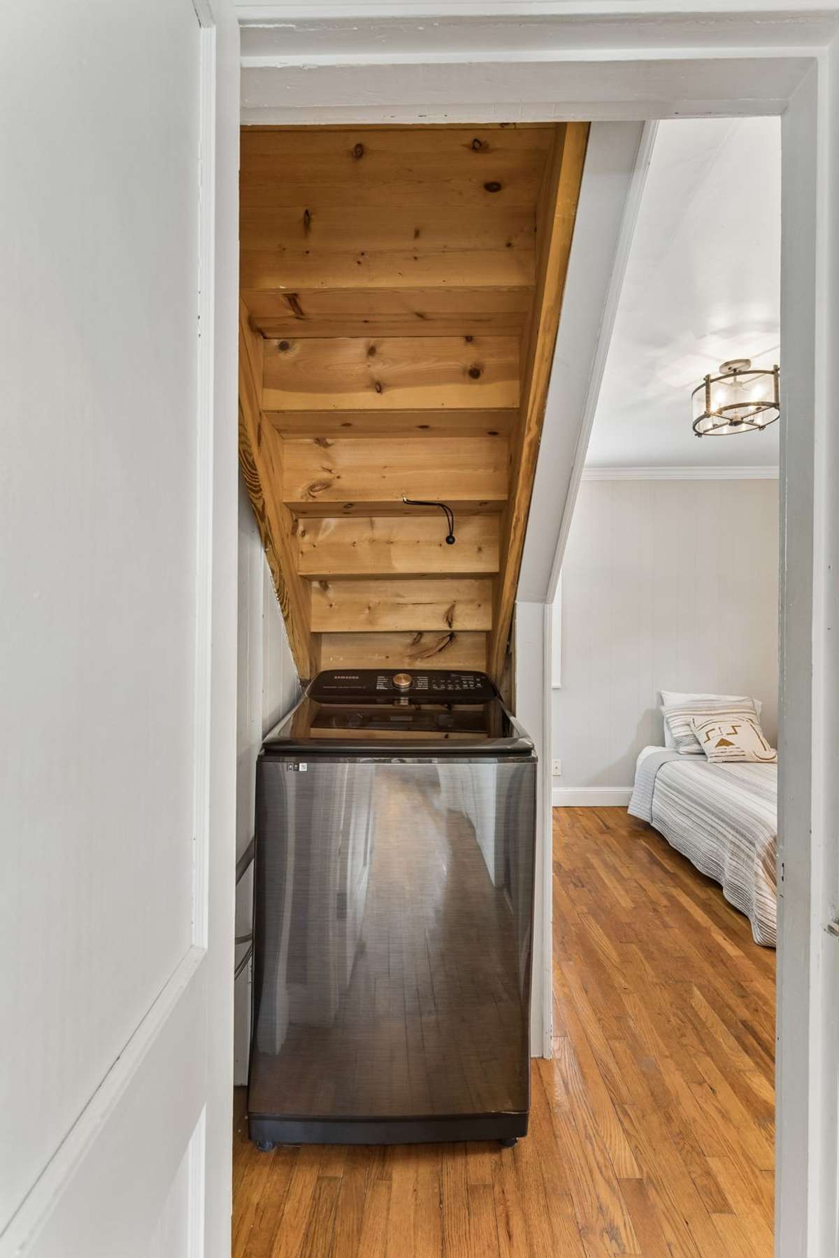 Washer currently located under the stairs in the flex/second bedroom. Dryer hook up also located in this room.