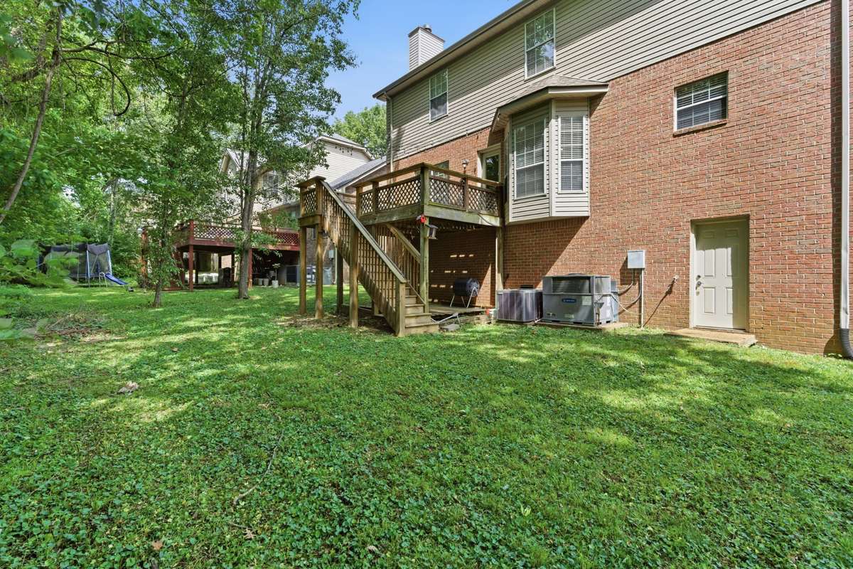 Private backyard with mature trees for shade and privacy. Access to massive crawlspace that can be additional storage or converted to more living space.