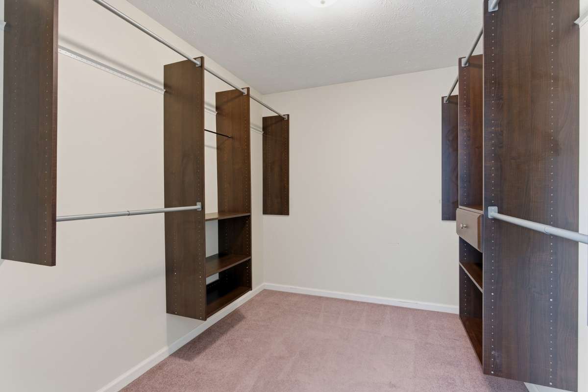Owner's walk-in closet (the size of a room!) with built-ins
