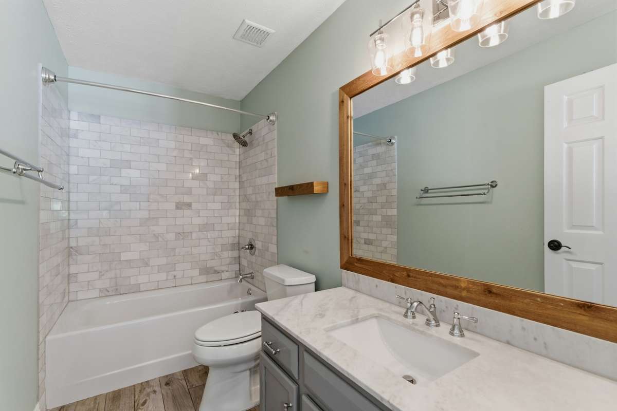 Second stylish full bathroom in between the two additional bedrooms.