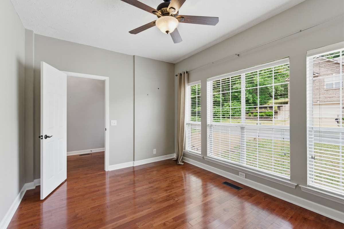 Bright and versatile, this space is filled with natural light and warm hardwood floors. Ideal as a fourth bedroom, home office, or flex room, it offers a clean, neutral backdrop and an easy layout to fit your needs.