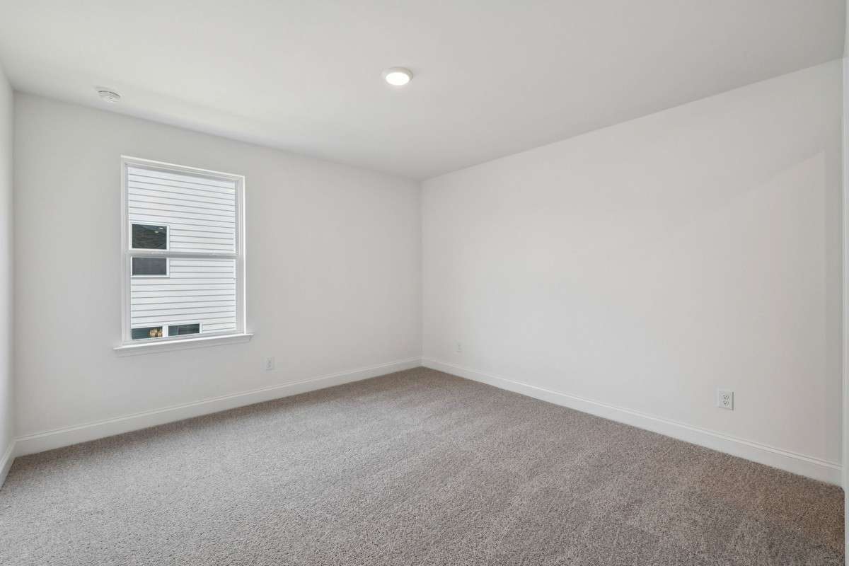 Macon bedroom 2. Picture is for illustrative purposes only. May be of similar home, same floorplan. Options, upgrades, colors, selections, designs, may vary.