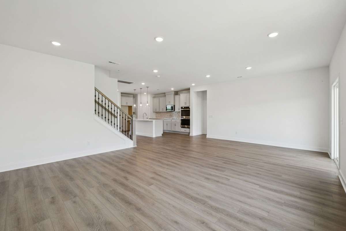 Macon great room Picture is for illustrative purposes only. May be of similar home, same floorplan. Options, upgrades, appliance package, colors, selections, designs, may vary.