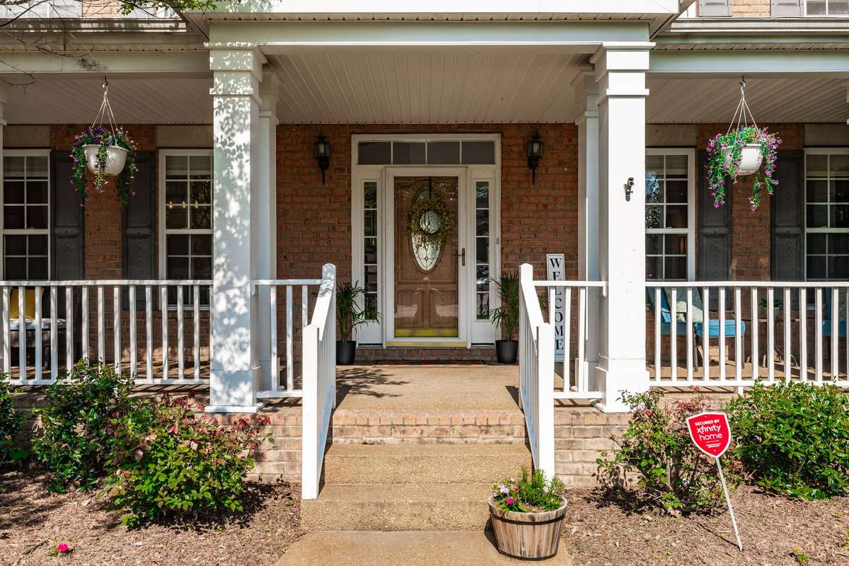 Spacious, covered front porch with Southern charm.