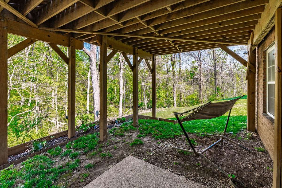 Back yard space under the deck provides a peaceful place for enjoying nature.