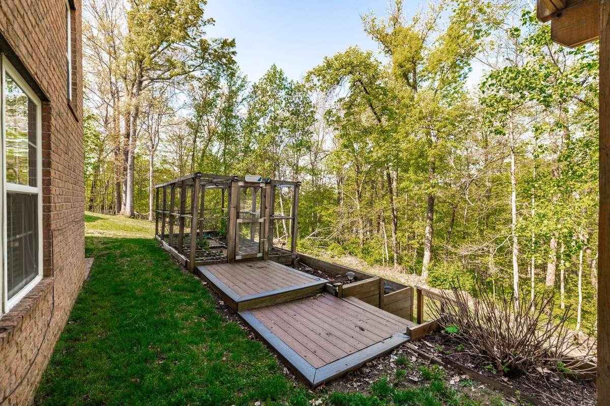 Deck platforms offer access to garden coop.