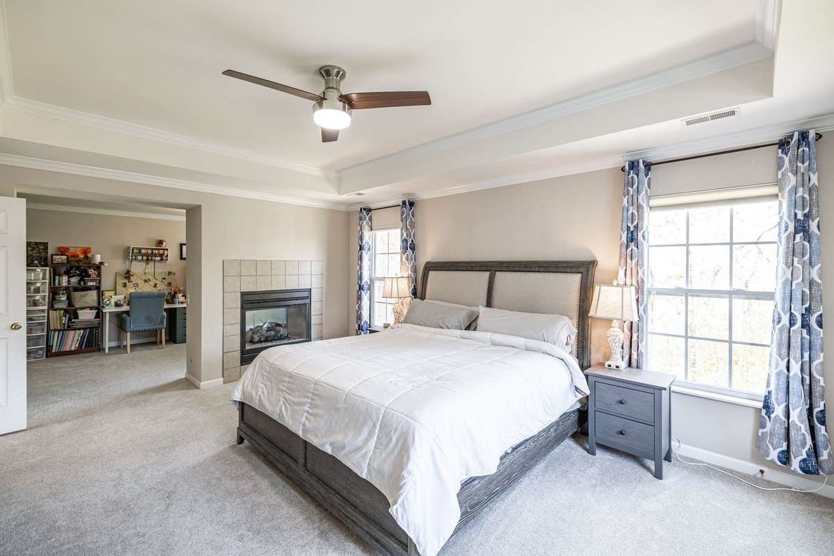 Primary bedroom has fireplace and separate office / hobby / work out space