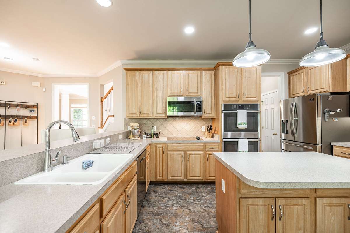 Kitchen island provides extra prep space and storage cabinets