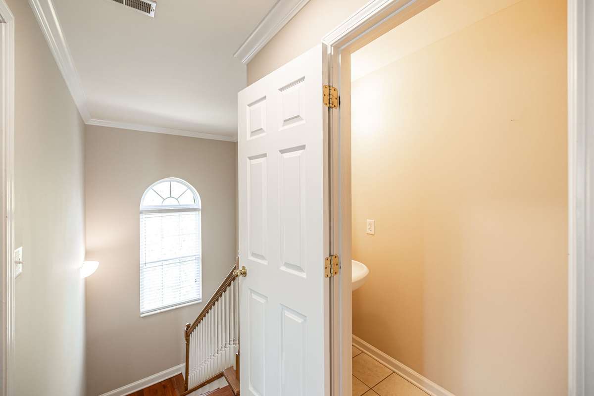 Upstairs half bath near top of stairs.