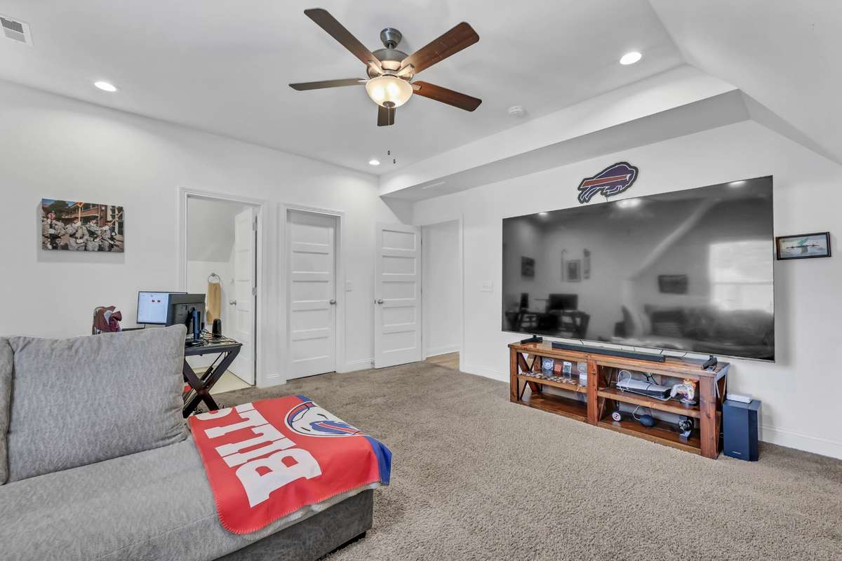 bonus room could be used as a 6th bedroom. It includes a half bath, closet and a door.