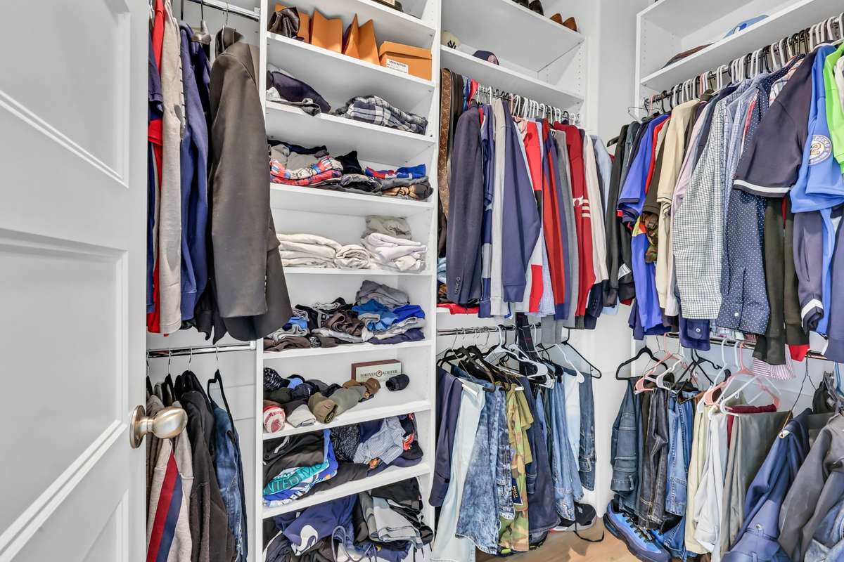 1 of 2 walk-in closets in the primary
