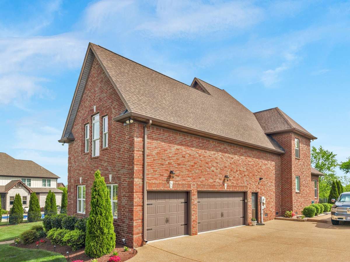 Three car garage with built in shelves