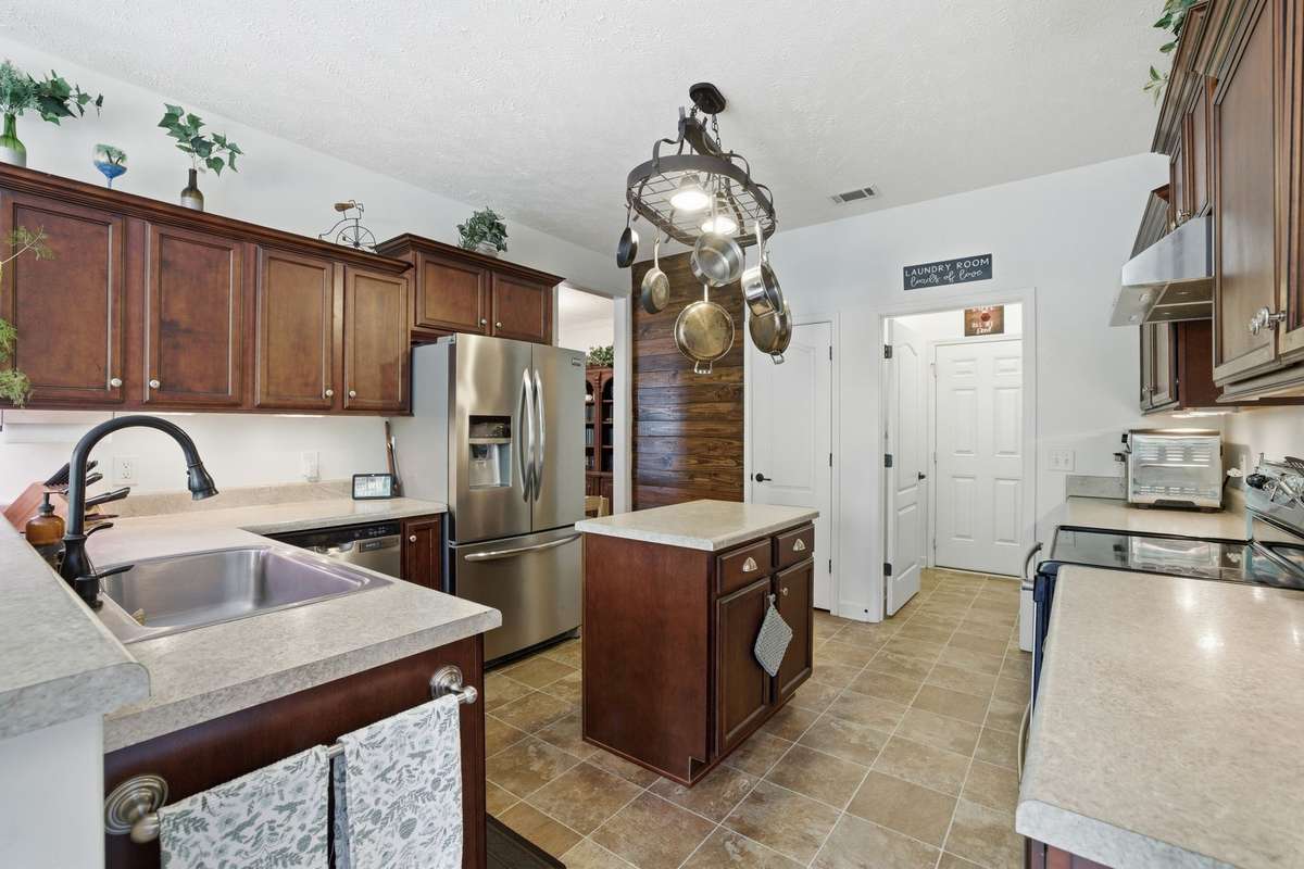Everything the gourmet in your home needs! Refrigerator, dishwasher, electric stove surrounded by plenty of counter and cabinet space.