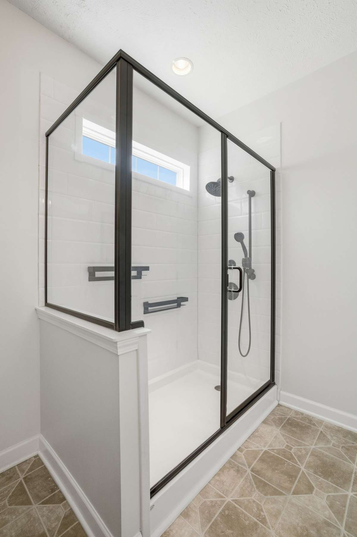 The shower has two shower heads! (one a hand-held)
