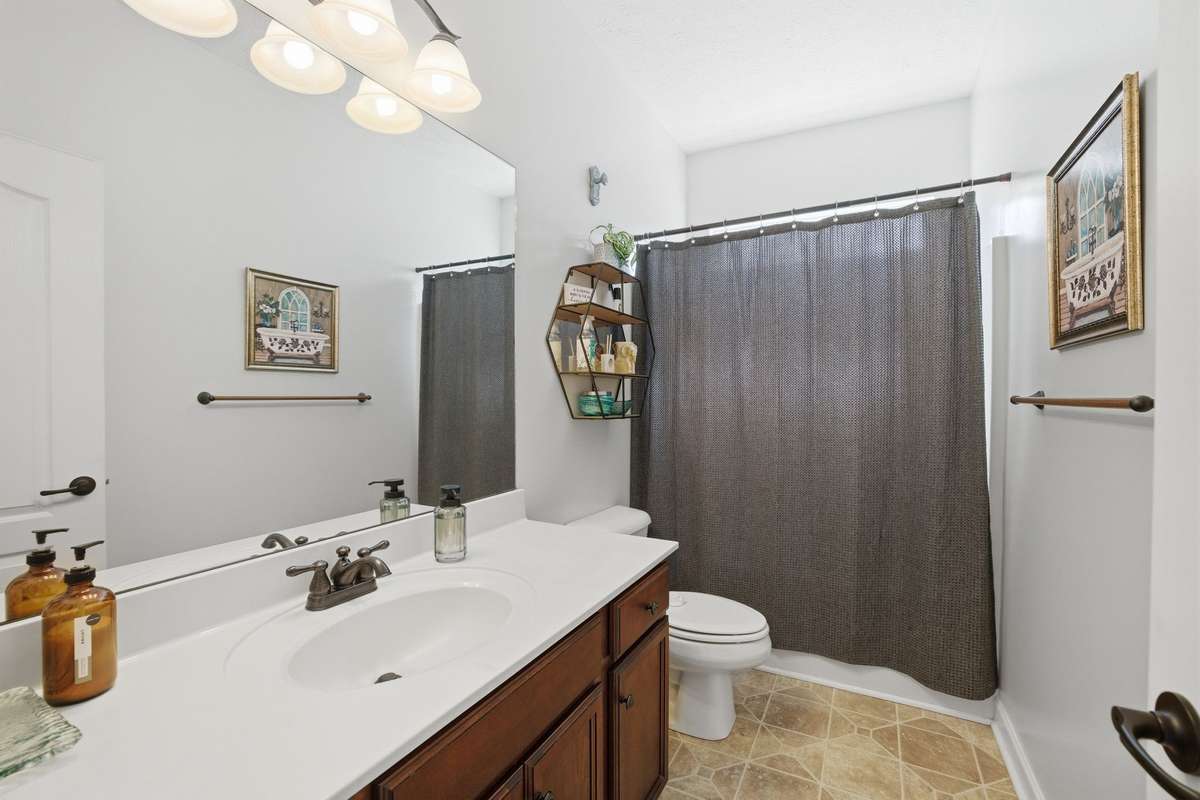 The 2nd full bath is located between bedrooms 2 and 3.