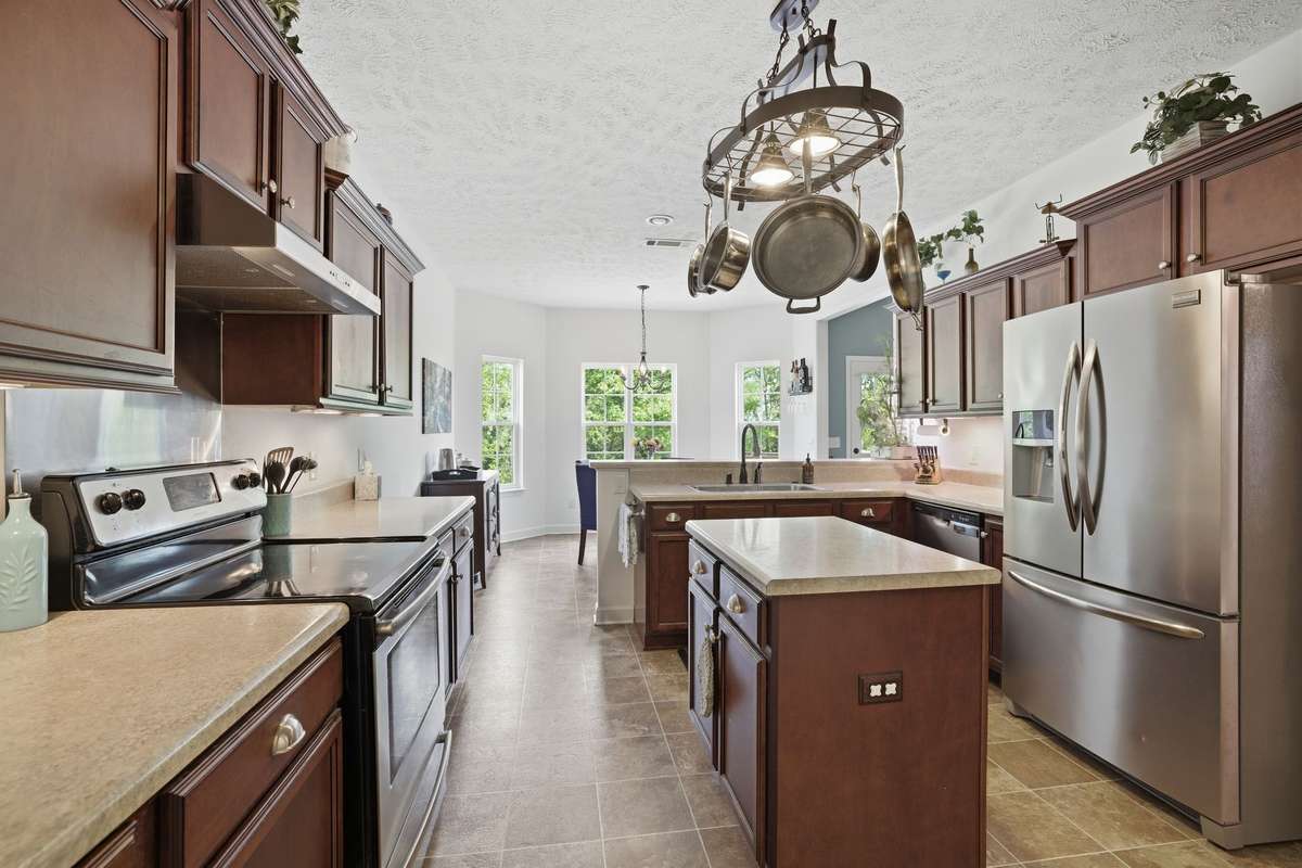 The island offers additional storage with an outlet provided for your smaller kitchen appliances.