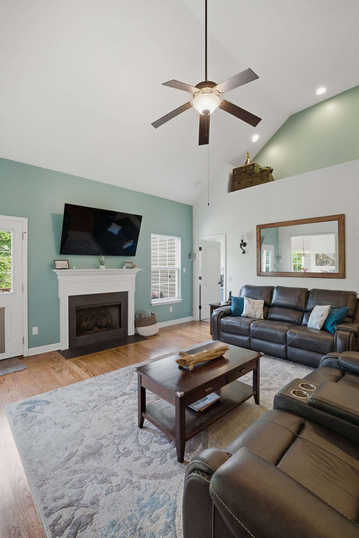 The high ceilings allow natural light to fill the room.