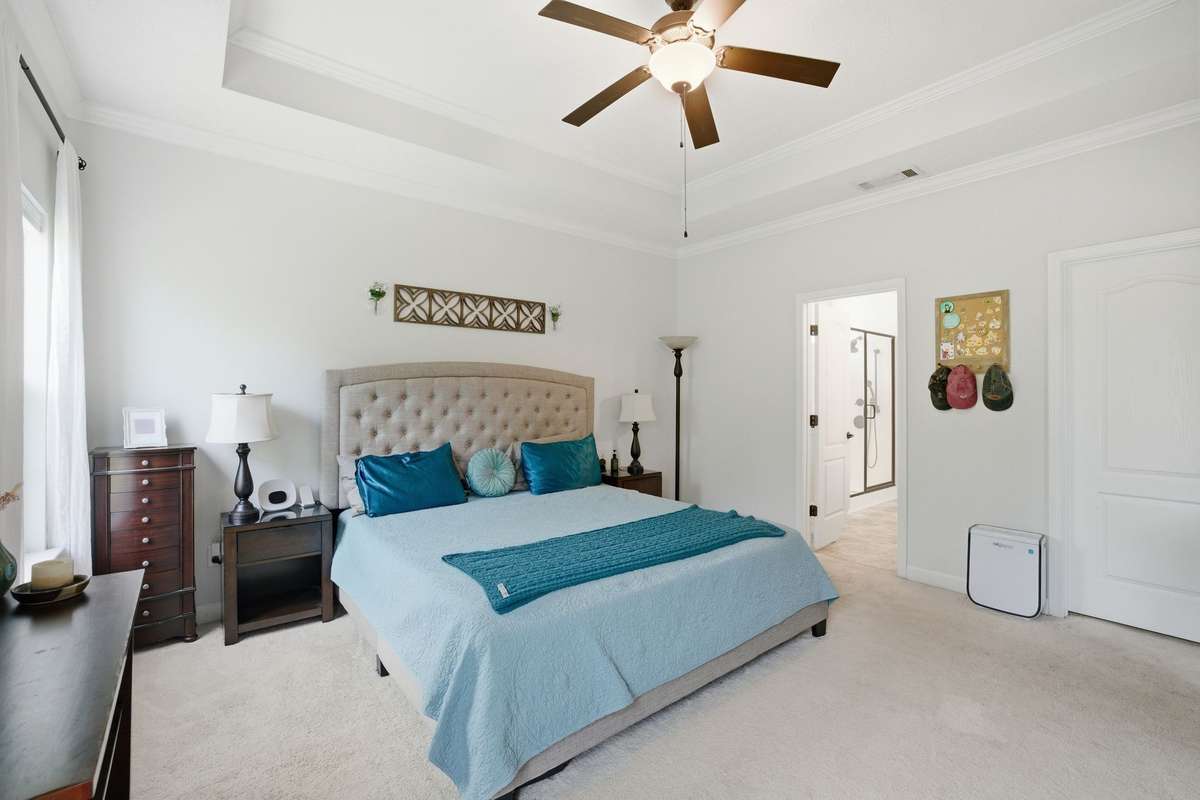 In this view you can peek into the primary bath. A walk-in closet is located on the far right in this photo.