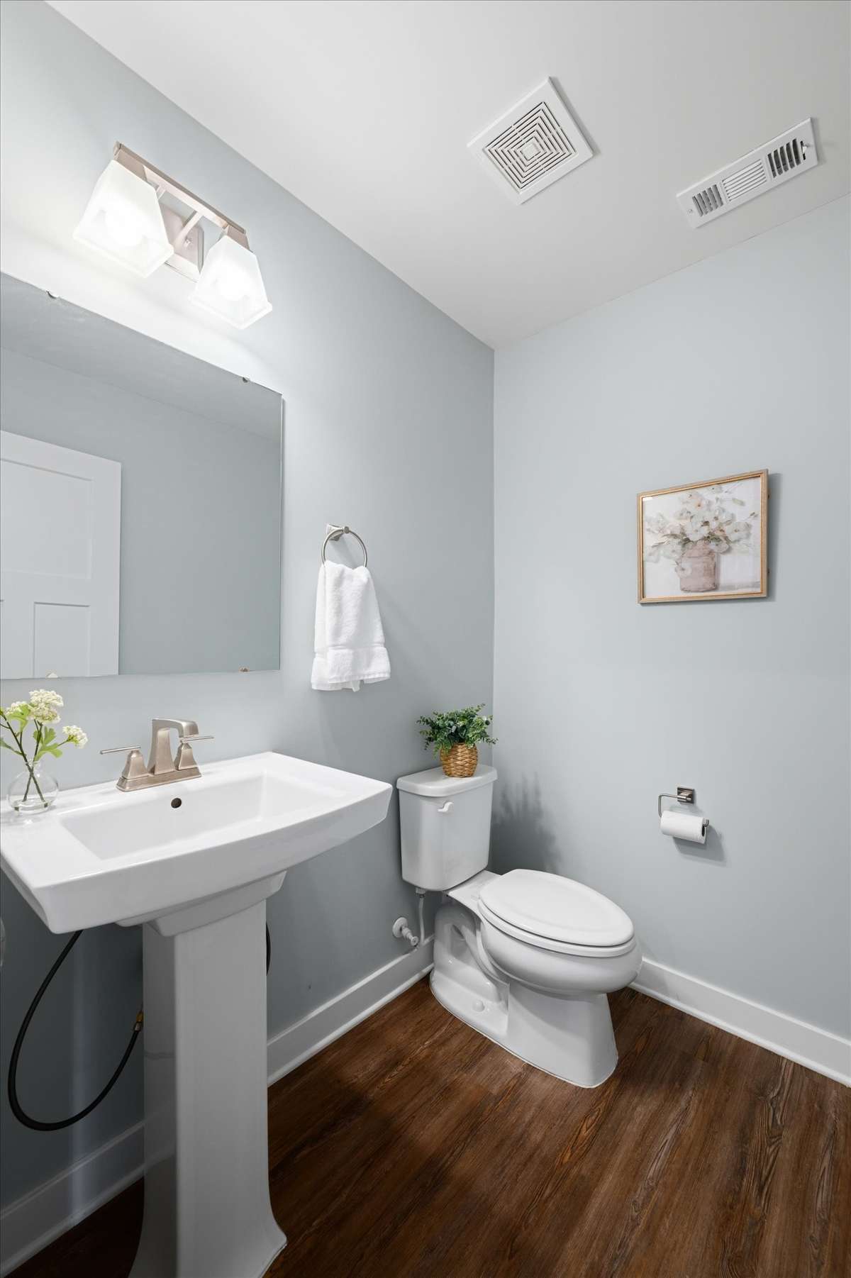The powder room is located near the foyer, convenient for guests.
