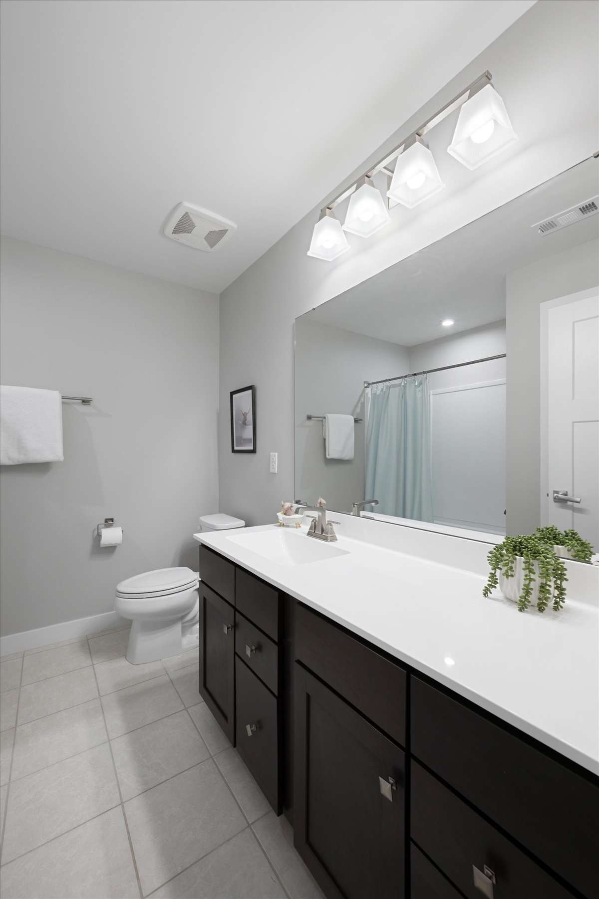 The upstairs bathroom has a shower/tub combo and has a plumbing rough-in for a second vanity.