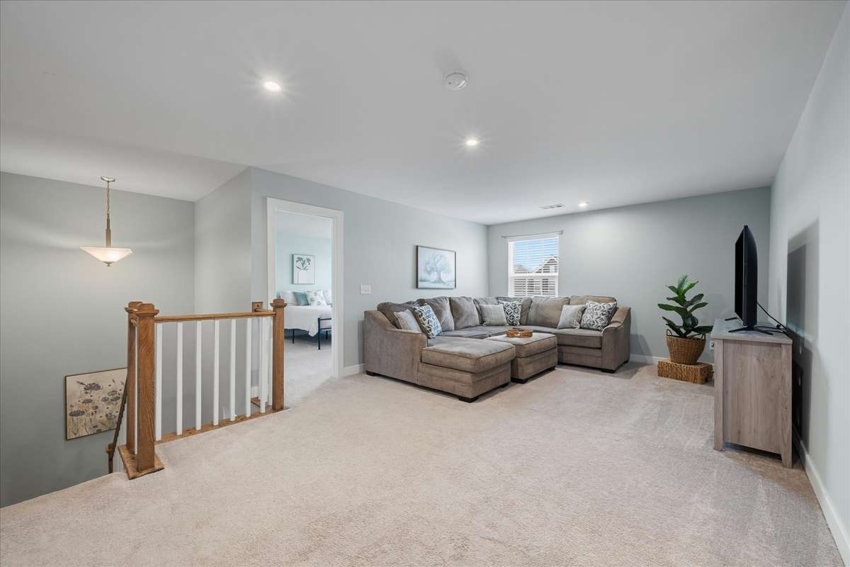 Upstairs is a loft area that affords flexible use options- home office, playroom, media or exercise space… ???  The possibilities are endless!