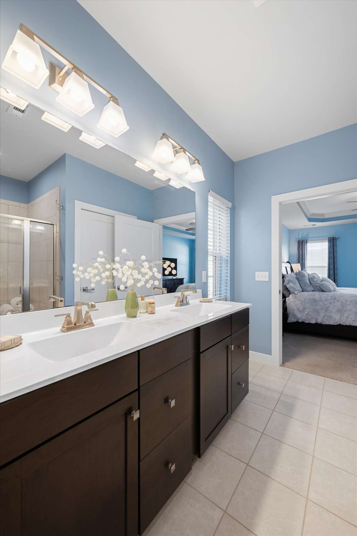 The primary bath has dual vanities and great storage.