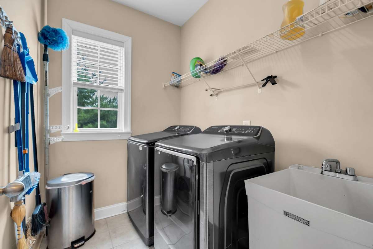 Laundry room and storage on the main level. Washer and Dryer convey.