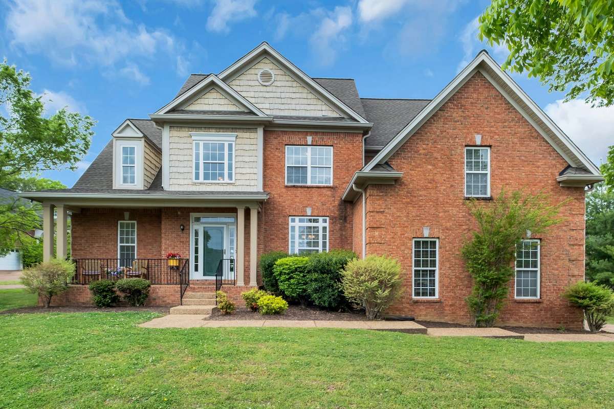 This brick home has a lovely front porch where hours can be spent enjoying the peaceful neighborhood.