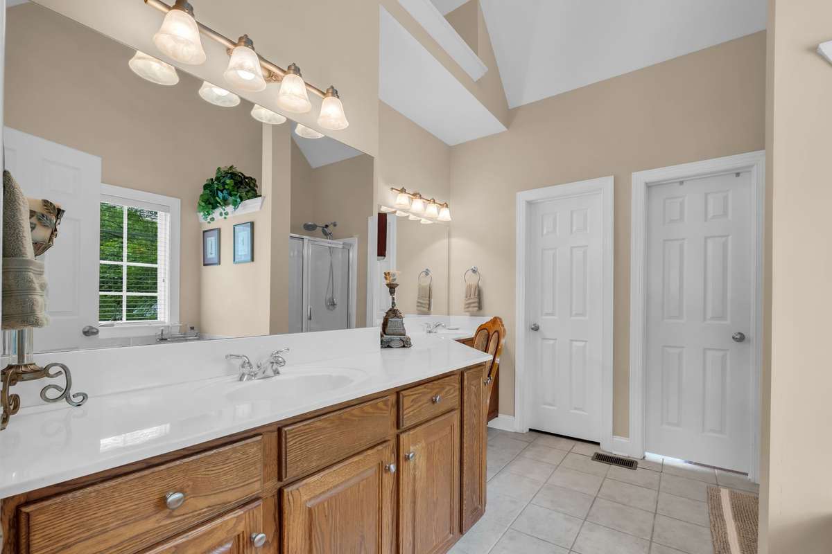 Double Sink Vanity plus an extension which has a sit down vanity area.