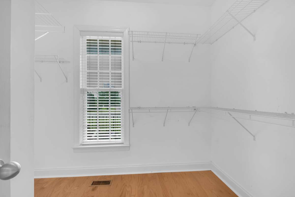Walk in closet can hold all your clothes and his too!