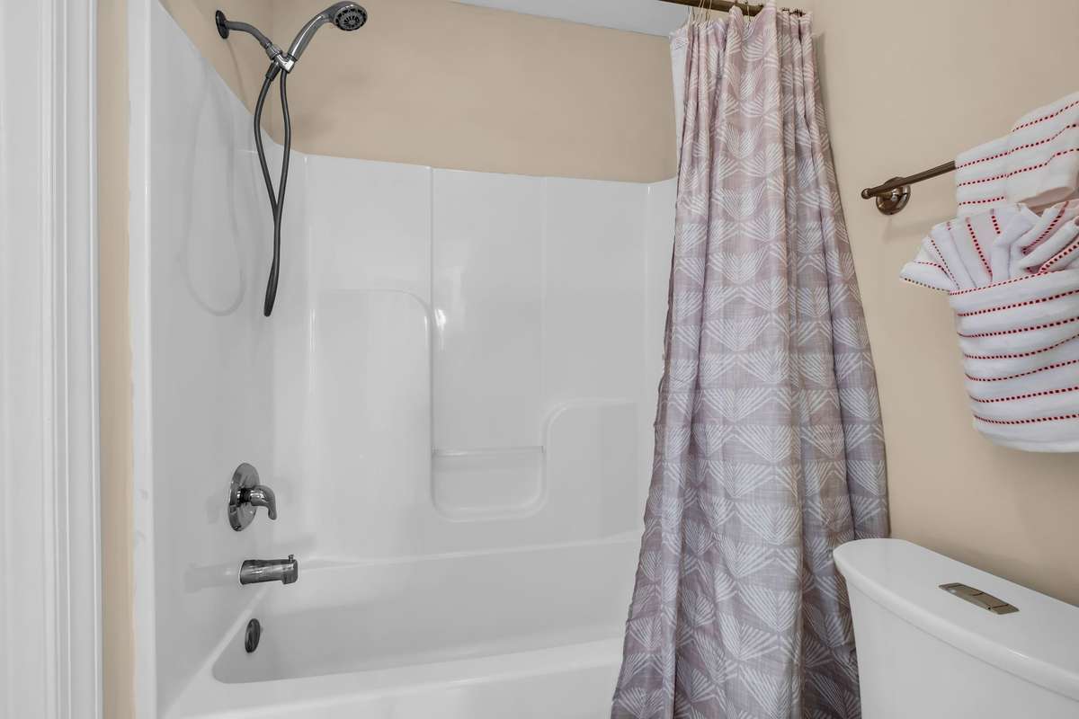 Shared Tub/Shower/Water closet area is the 3rd full bathroom for this home.