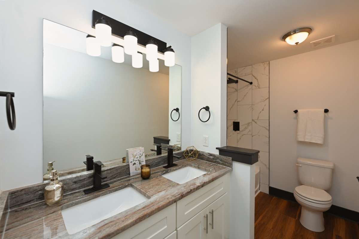 Updated Primary Bathroom with Granite and His and Her sinks