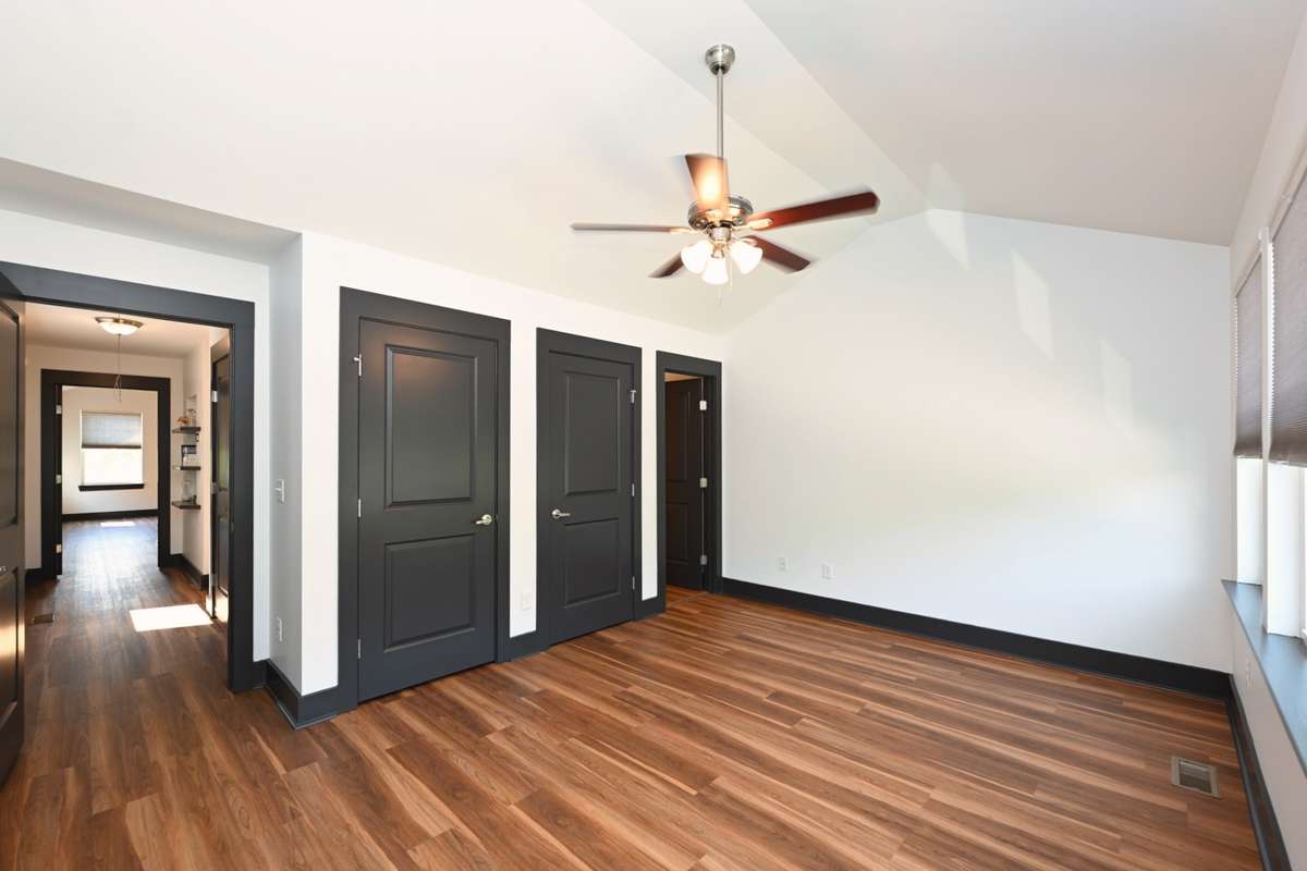 This bedroom has 2 closets and a full bathroom