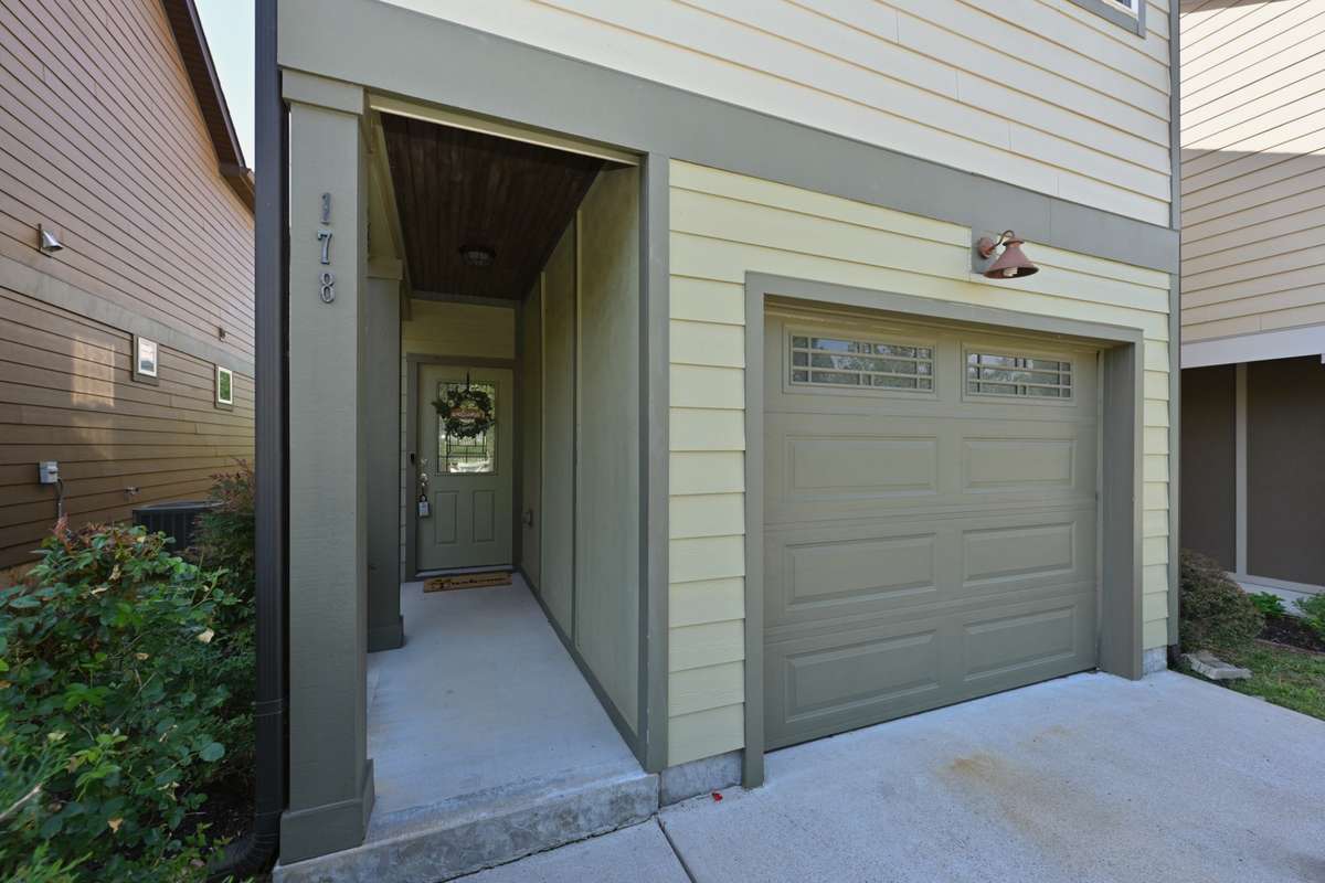 Covered Front porch with stained wooden ceilings