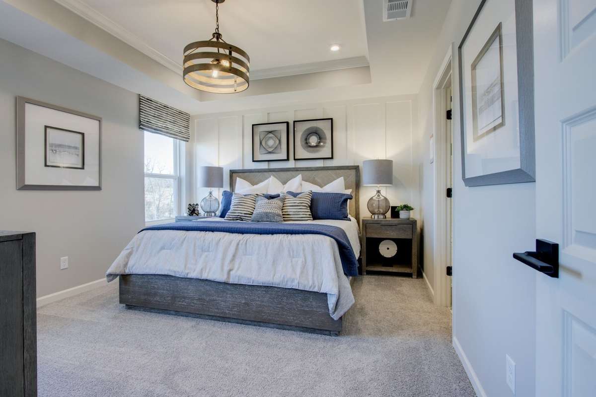 Primary Suite upstairs. King bed. All photos are of model home*
