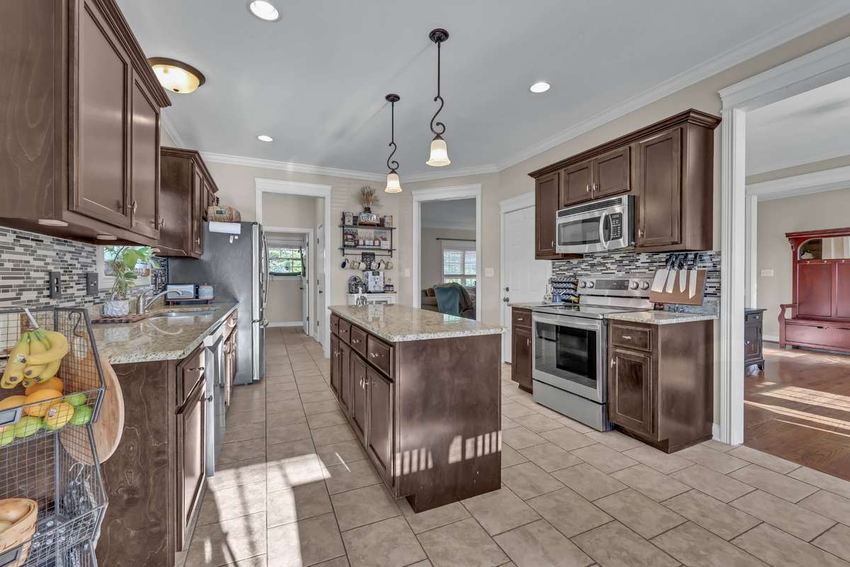 2971 Prince Drive - Spacious kitchen with backsplash, granite, stainless steel appliances and tile floors.