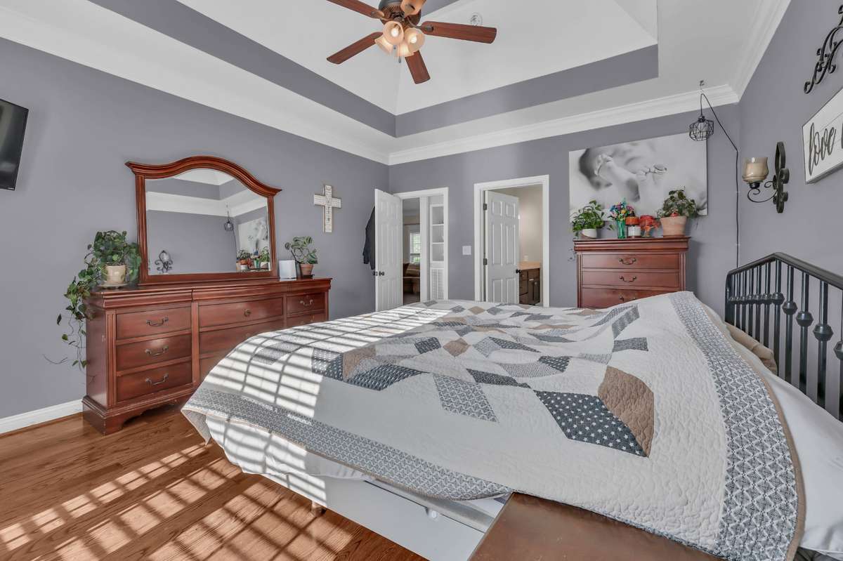 2971 Prince Dr. - Primary Bedroom on main level with hardwood flooring and trey ceiling.