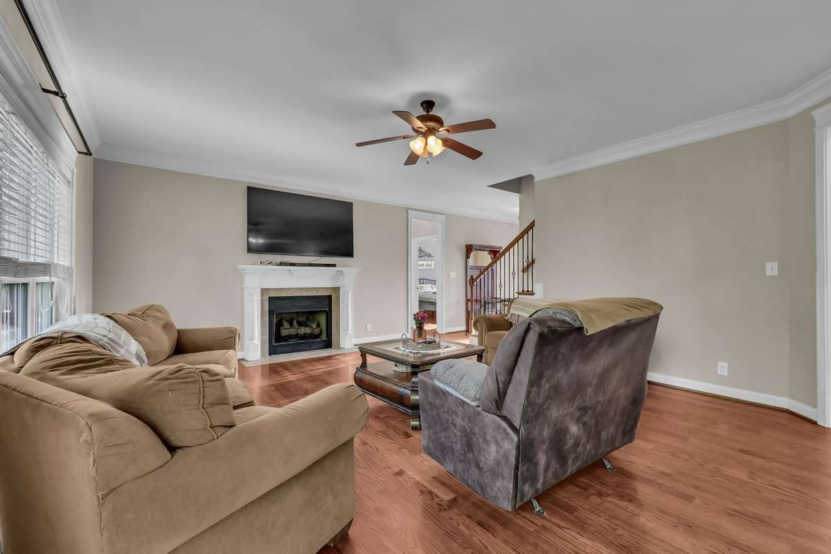 2971 Prince Drive - Great Room offers hardwood floors and fireplace with gas logs.