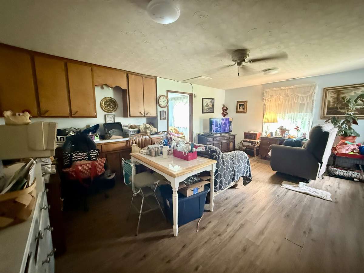 The separate den has built-in cabinets and countertops.