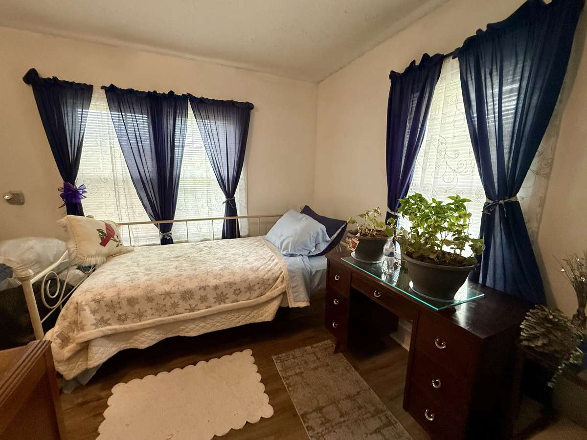 Third bedroom with vinyl flooring, closet and lots of natural light.