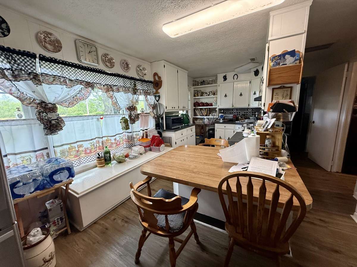 The kitchen has a peninsula island with bar seating.