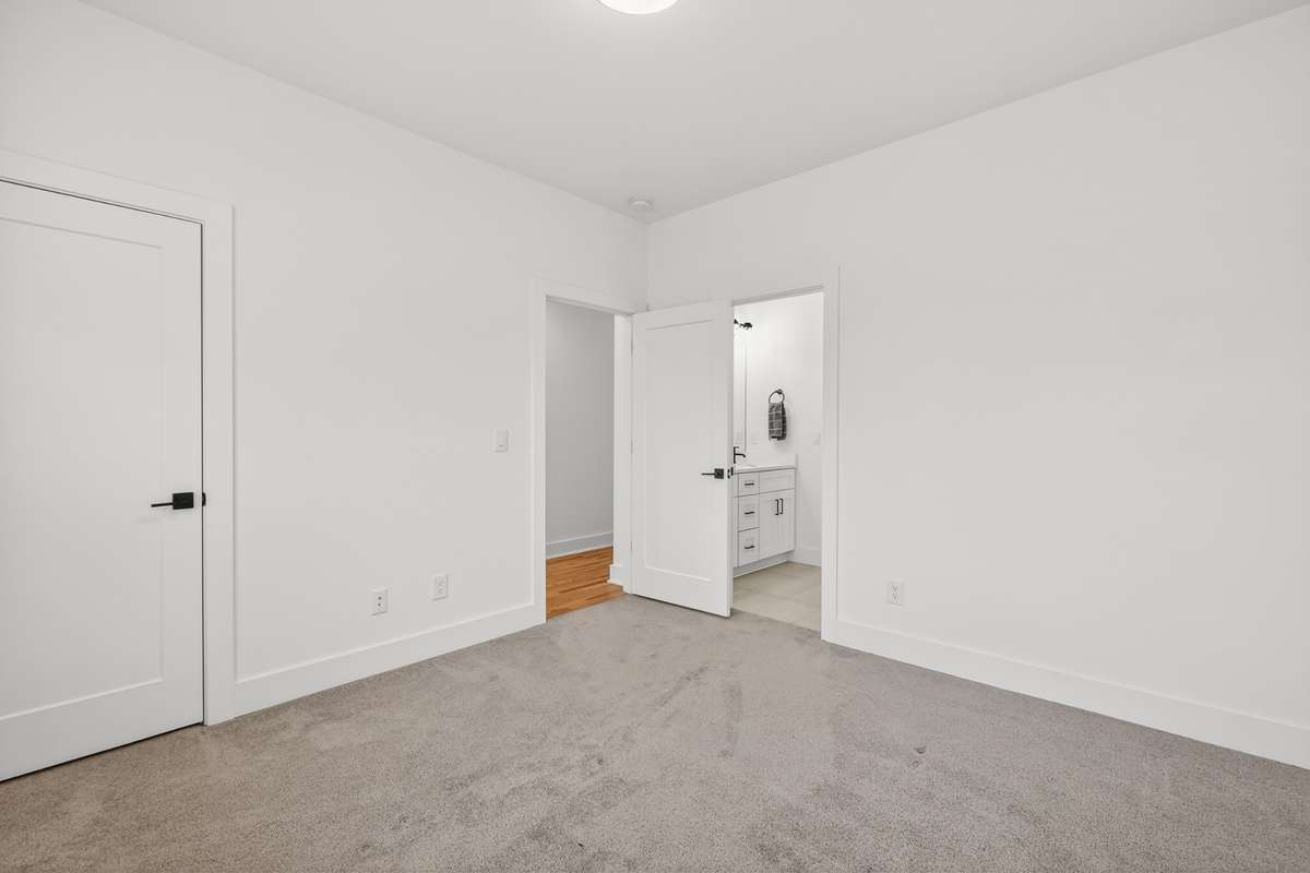 Third bedroom with large walk-in closet. This bedroom also shares access to the Jack-and-Jill balthroom.
