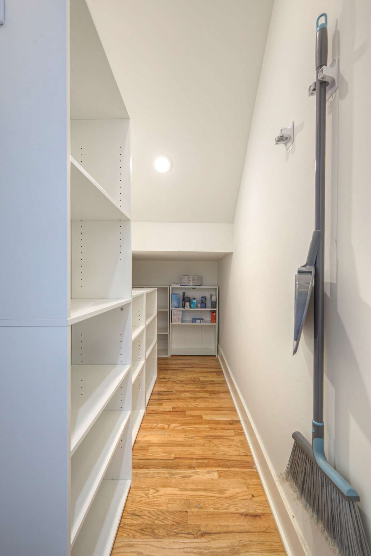 Extra large storage closet beneath the stairs. Shelving to remain.