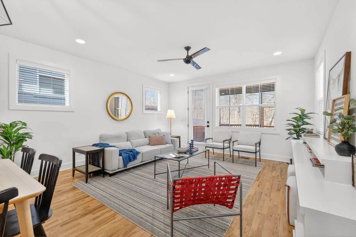 Living room area with lots of space and acess to the covered and screened in deck area.